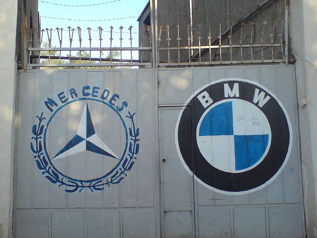 640px-Mercedes_and_Bmw_Symbol_On_a_garage_door_at_Nishapur